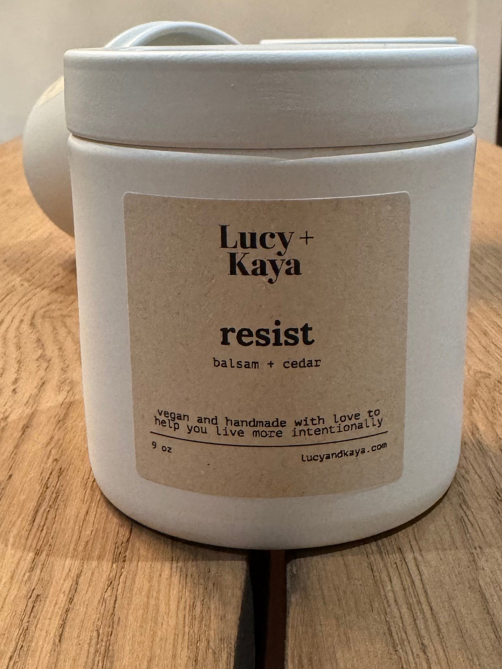 White container with a label on a wooden surface